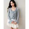 Elegante blusa de tricô com babados, novo design para o início do outono de 2026, suéter que emagrece e valoriza a silhueta