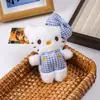 Nuevo colgante KT gatito pata de gallo lindo peluche accesorio para bolso llavero al por mayor del fabricante