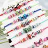 Pulsera tejida a mano con mariposa de dibujos animados linda color nuevo transfronteriza con goteo de aceite para amantes en stock al por mayor