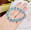 Pulsera de lujo europea y americana con diamantes de alto carbono y aguamarina en forma de corazón oceánico. Venta al por mayor de joyería transfronteriza.