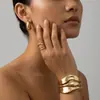 Venda quente transfronteiriça moda metal geométrico oco formato de gota d'água conjunto de anel pulseira brinco tarraxa feminino atacado