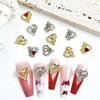 Joyería para uñas estilo lujo ligero amor hueco joyería de aleación aleación roja día de san valentín joyería para uñas accesorios al por mayor