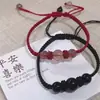 Mi nombre es Flor de durazno Zhao pulsera de cristal de fresa en la orilla cuerda de mano tejida de cristal rojo paloma adornos de mano para amantes novias fuera de un solo uso