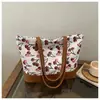 Bolsa feminina 2026 primavera nova bolsa de compras, grande capacidade, estampa de cereja, bolsa tote moderna e simples, bolsa de mão
