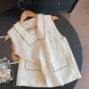 Camisa sin mangas de ramio 2026 Nuevo estilo de verano Blusa vintage con solapa Bolsillo decorativo para mujer Chaleco cárdigan de color liso