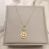 Explosiones de comercio exterior versión coreana de bolsa de expresión de cara sonriente simple collar de acero inoxidable moda Joker divertido collar de cara sonriente al por mayor