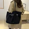 Bolso de Hombro de Lona de Gran Capacidad 2025 Nuevo Textura de Moda Bolso de Lona Casual Bolso Bandolera para Viajes y Commute Bolso de Axila
