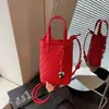 Pedido Extranjero Bolsos de Nicho para Mujer 2026 Nuevo Bolso Cubo con Patrón Tejido Bolso de Mano para Viaje Hombro Cruzado Bolso para Teléfono