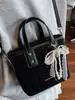 Bolso de Cubo Casual de Moda y Texturizado Nuevo Verano 2025 Elegante Simple de Nicho para Mujer Bolso de Hombro Cruzado