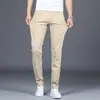 Pantalones casuales para hombre, nuevos pantalones tipo cigarrillo ajustados de negocios color caqui para primavera y otoño, pantalones largos elásticos para hombre, versátiles de largo nueve puntos