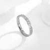 Anillo de moda de personalidad de Europa y Estados Unidos semicírculo micro incrustación CNC diez diamantes oro rosa anillo de acero de titanio anillo de niña anillo de cola