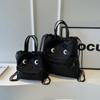 Bolso de lona de gran capacidad para mujer 2024 Nueva Moda bolso casual de hombro con cordón bolso de cubo mochila versátil bolso de viaje