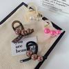 Estilo coreano elegante pérola grampo de cabelo feminino Retro marrom High-end Sentido Voltar Cabeça Agarrar Clipe Tubarão Elegante Cocar