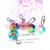 Nueva Cadena de Cuentas de Crisantemo con Carita Sonriente Acrílica Pequeño Colgante Colgante para Caja de Audífonos Bolsa Decorativa Pequeña Joyería