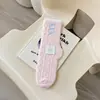 Calcetines de invierno para mujer fabricantes al por mayor calcetines de terciopelo australiano con lazo retorcido nuevos gruesos dulces de color liso para dormir