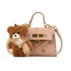 Bolso de lunares estilo coreano para niñas pequeñas, con un adorable charm de oso de peluche, un nuevo minibolso cruzado para bebés y niños