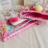 Muñeca con estampado de dibujos animados florales, bolsa de almacenamiento de artículos de tocador y necesidades diarias con arena movediza transparente, bolsas pequeñas de maquillaje, fabricantes, venta al por mayor