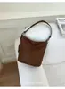 Bolso de cubo de nicho de alta gama transfronterizo para mujer, nuevo bolso de hombro tejido estilo vintage para el trabajo y los desplazamientos