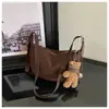 Bolso de mano tipo dumpling de diseño nicho transfronterizo, nuevo bolso de axila casual y moderno para mujer, adecuado para el trabajo y los desplazamientos, bolso de hombro, bolso cruzado, moderno
