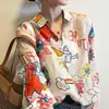 Camisa de Moda Retro Estampada con Cuello para Mujer Primavera/Verano 2026 Nueva Camisa Fina Protectora del Sol para Mujer Moderna