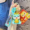 Año del Dragón lindo dragón pequeño resina llavero para coche femenino exquisito muñeco de dragón del Zodiaco colgante para mochila creativo regalo de Año Nuevo