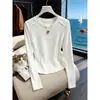 Elegante camiseta de manga larga ajustada para mujer, nuevo modelo otoño 2026, simple y chic, versátil, color albaricoque, top de algodón puro