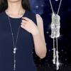 Collar largo de cadena para suéter con accesorios florales transfronterizos para mujer, colgante de borla de cristal, colgante para ropa, joyería simple al por mayor