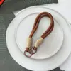Colgante para Teléfono Caballo Rojo de Año Nuevo Lanyard de Moda para Mujer con Textura de Cuero de Alta Gama Correa de Muñeca Universal Cruzada de Nicho Bolso de Mano
