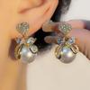 Pendientes elegantes con forma de corazón de melocotón y perla con microincrustaciones de circonita y aguja de plata S925 de moda de Corea del Sur.