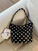 Bolso cruzado de nailon con lunares de nicho para mujer 2025 Nuevo bolso versátil de hombro y axila para salir y trabajar Bolso de mano pequeño