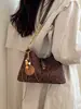 Bolso de mano de diseño nicho estilo coreano transfronterizo para mujer, moderno, simple, color liso, texturizado, elegante, bandolera y de hombro vintage
