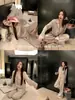 Pijama simple de seda de hielo con lunares para mujer 2026 primavera y otoño nuevo conjunto de ropa para el hogar francés dulce de manga larga y pantalón largo
