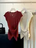 Top de punto de manga corta irregular con diseño cruzado para mujer, nuevo diseño de principios de otoño, ceñido a la cintura, adelgazante, con temperamento, top acanalado simple