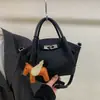 Bolso de Mujer Transfronterizo 2026 Nueva Temporada Primavera/Verano con Acabado de Alta Gama, Moderno y Súper Popular, Gran Capacidad, Bolso Cubo de Hombro y Cruzado a la Moda