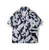 Cuello de solapa 2026 Estilo nuevo Camisa floral para hombre Estilo coreano Holgada Moda Estampada Estilo playero Casual Camisa de manga corta Exportación