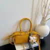 Bolsa de mão feminina de luxo 2026 nova moda nicho bolsa almofada trançada requintada bolsa de ombro transversal para o dia a dia
