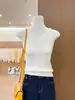 Impresionante camisola de punto sin mangas en color amarillo para mujer, adecuada como prenda exterior de verano o como capa interior.