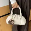 Bolso de mano de diseño nicho transfronterizo, bolsa de bolos para mujer, nuevo bolso retro elegante para el día a día, bolso de hombro y cruzado súper popular