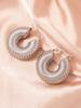 Pendientes exagerados de acero inoxidable transfronterizos europeos y americanos con hebilla circular de hilo distintivo, pendientes de lujo ligeros de moda de comercio exterior para mujer.