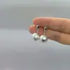 2026 Novos Brincos de Bola Minimalistas de Metal Escovado de Alta Qualidade para Mulheres, Design de Nicho, Tarraxas e Pingentes Únicos