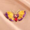 Nueva moda creativa, broche de mariposa de moda, doble color, gota de aceite, diamante, esmalte retro, decoración sencilla para el pecho, gran sentido.