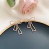 Versión coreana de pendientes de lazo de plata 925 con diamantes de imitación, pendientes de temperamento de viento de alta sociedad, pendientes de personalidad de moda, una generación de cabello