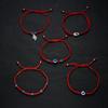 Venta caliente transfronteriza Nuevo Palma dos cuentas redondas ojos azules mal de ojo pulsera tejida con cuerda roja ajustable venta al por mayor de fábrica