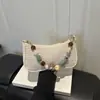 2026 Verano Nuevo Bolso de Mano de Moda para Mujer Bolso Tejido de Paja a la Moda para el Hombro Ligero Bolso Tejido de un Solo Hombro Bolso de Mujer con Perlas