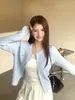 Jaqueta cardigan azul suave e doce para mulheres, novo look estilo coreano para o início do outono 2026, suéter com laço, top de tricô