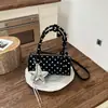 Bolso de mano coreano nuevo transfronterizo 2026, bolso tote pequeño para mujer, bolso cilíndrico de nicho de lunares de alta gama, bolso de hombro y bandolera