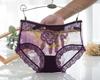 Venta al por mayor bragas de encaje sexy para mujer nuevo encaje bordado sin costuras damas malla tiro medio calzoncillos fabricantes