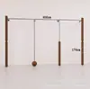 Estante de ropa de acero inoxidable montado en la pared para tienda de ropa, estante vintage color veta de madera de nogal, exhibidor de piso para ropa de mujer