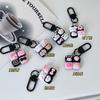 Llavero cuádruple negro con dibujos animados, divertido colgante de perro Sanrio Yugui Kulomi, accesorios para pareja y novia.