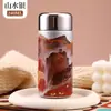 Nueva botella de agua aislada de titanio estilo chino, un diseño elegante y práctico dos en uno para mujeres, perfecta para la salud y el bienestar, y fácil de llevar en el bolsillo.